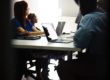 Adults in chairs in a class