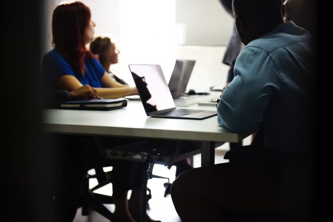 Adults in chairs in a class